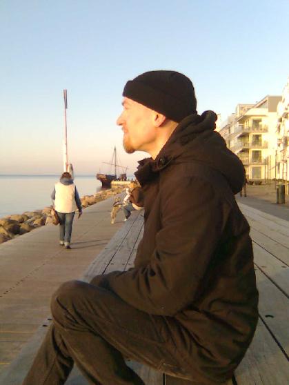 Photo of MC looking contemplative.