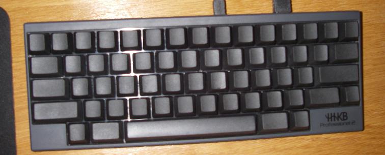 A black 60% keyboard with no labels on keys